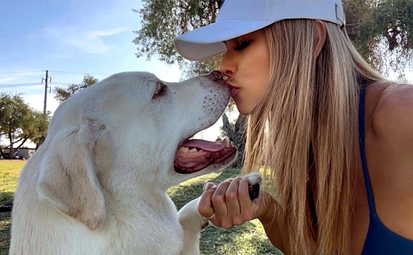 Erika with her yellow Labrador, Logan