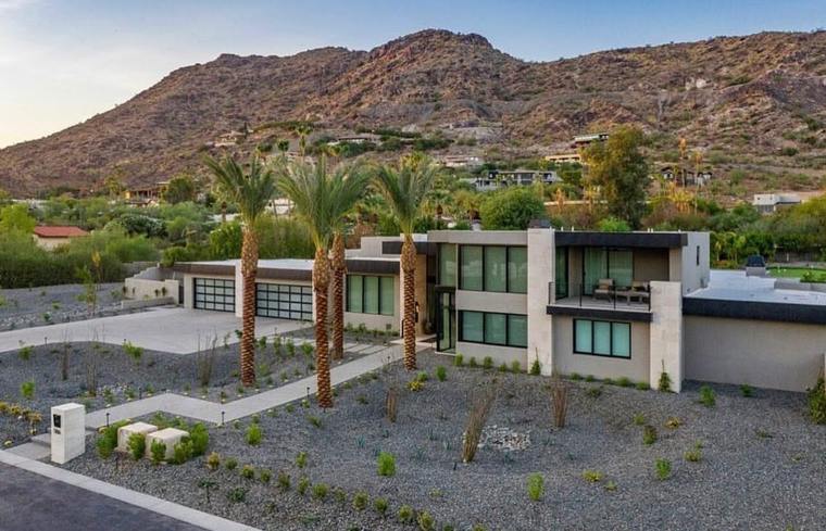 Contemporary residence against an Arizona desert mountain